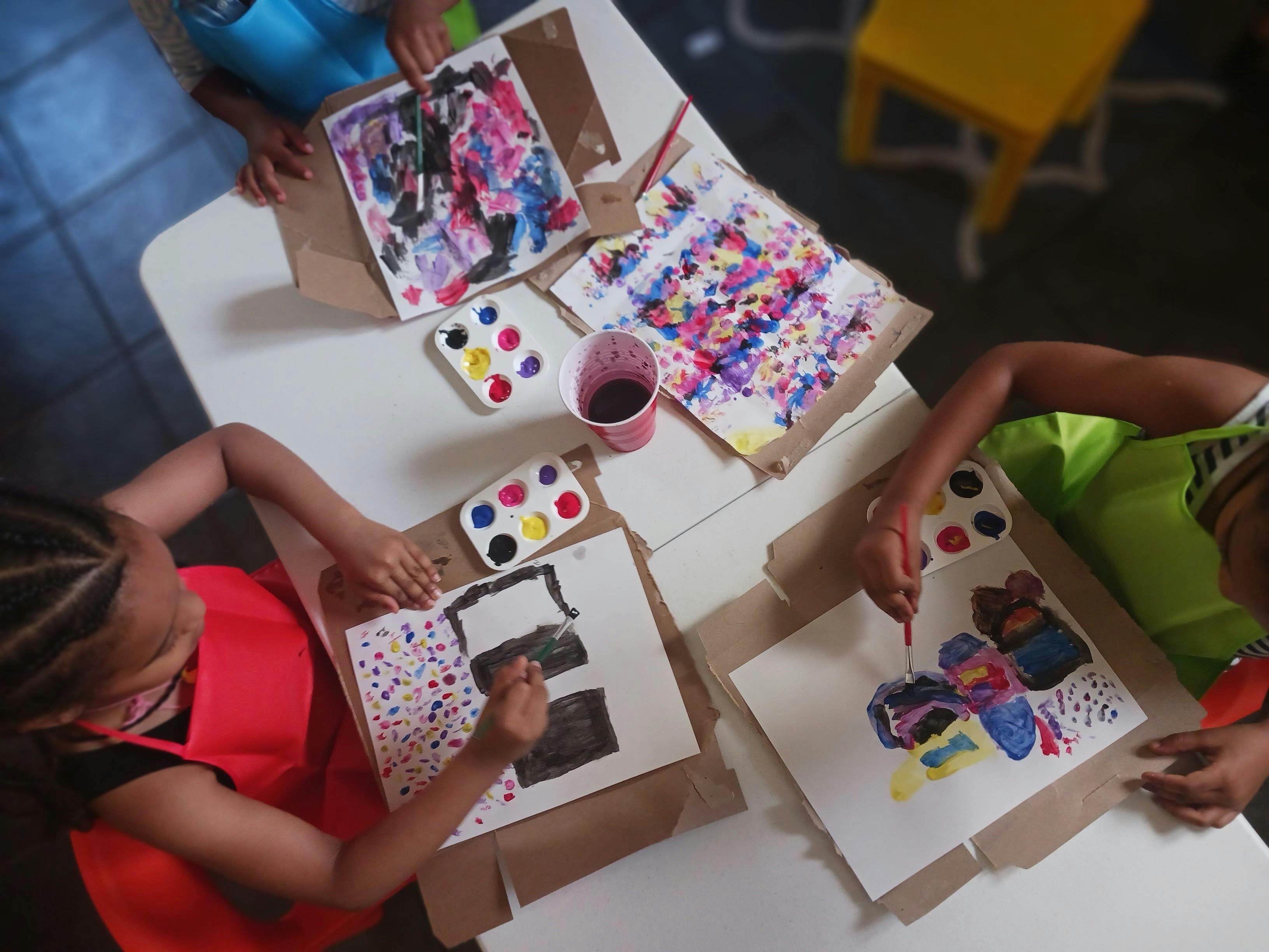 Children painting at a table