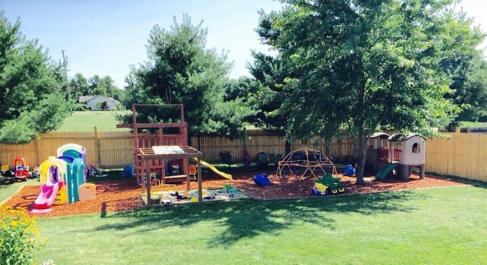 Outdoor playground with various play structures and slides