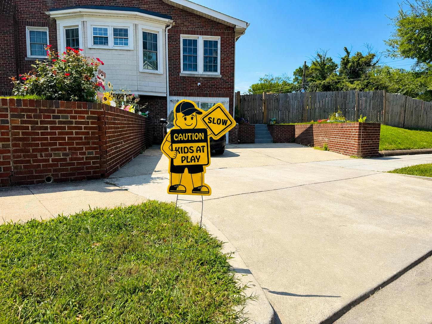 Caution Kids at Play sign on a residential driveway