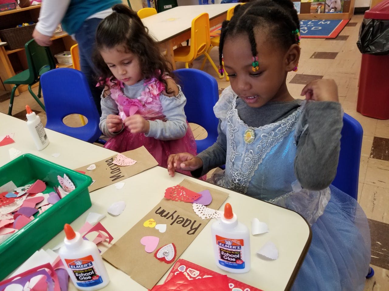 Two children doing crafts at a table