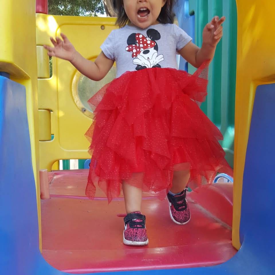 Child standing on a playground structure