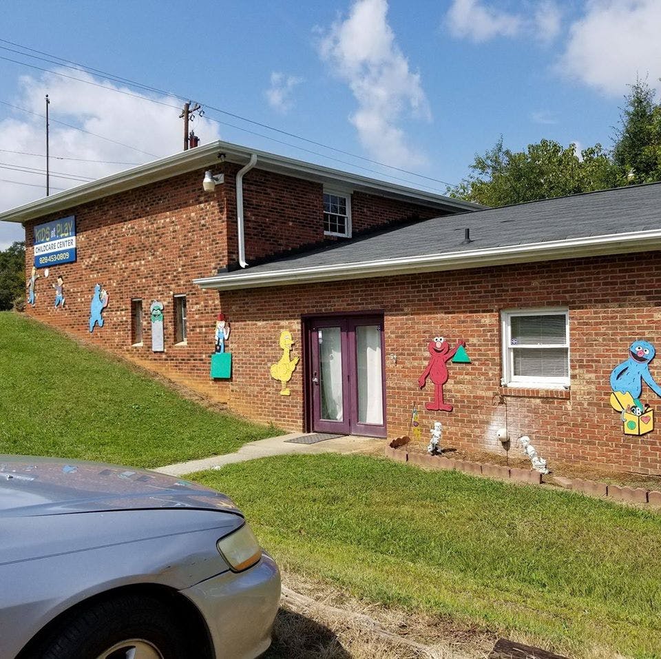 Brick building with colorful cutouts on the wall