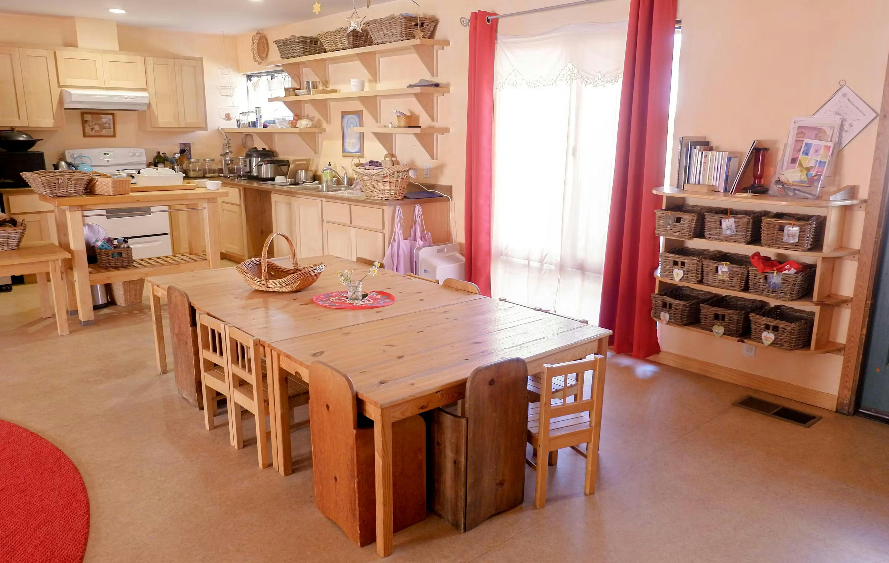 Kitchen and dining area with wooden table and chairs