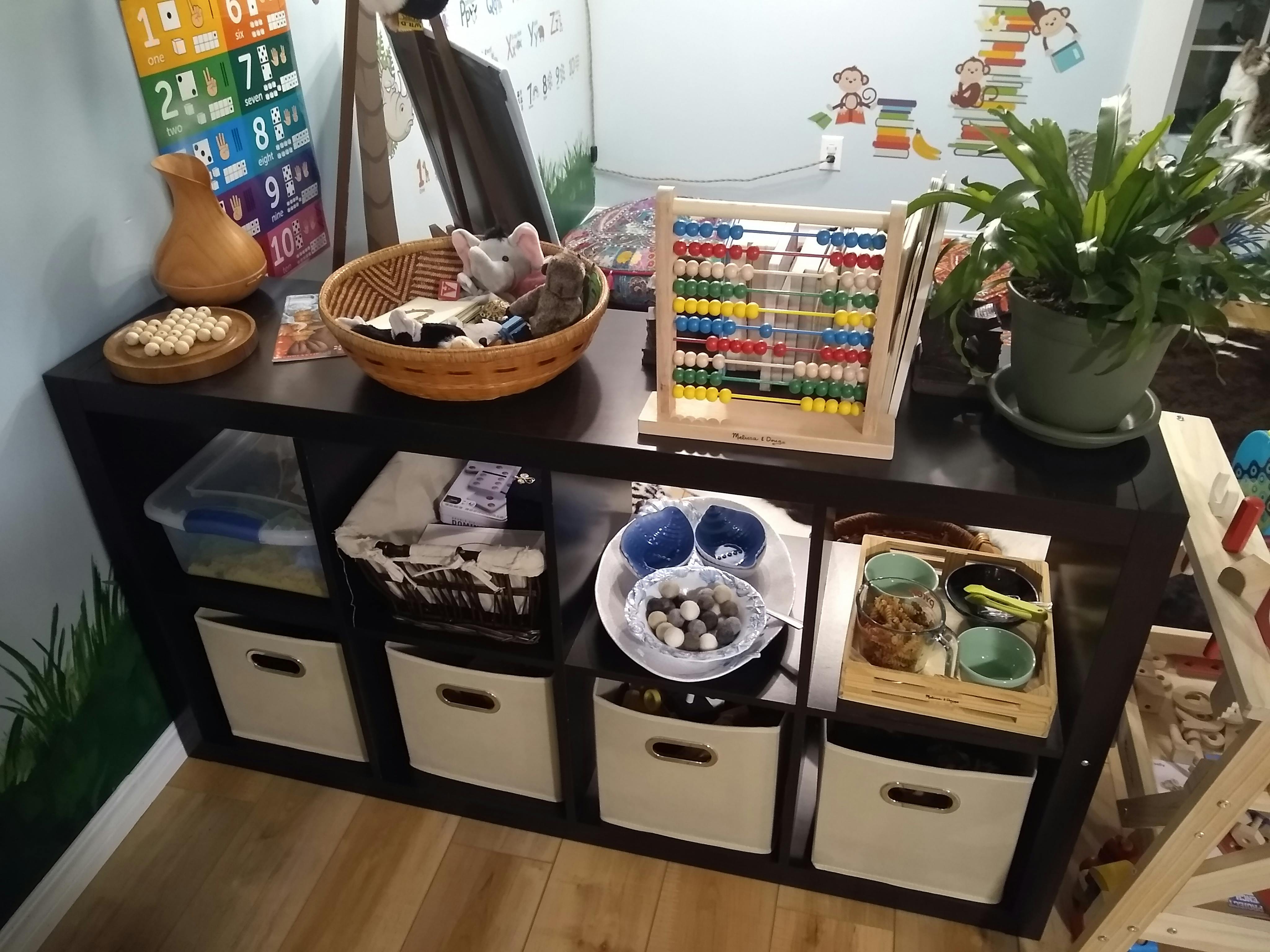 Shelf with an abacus, plant, and various containers