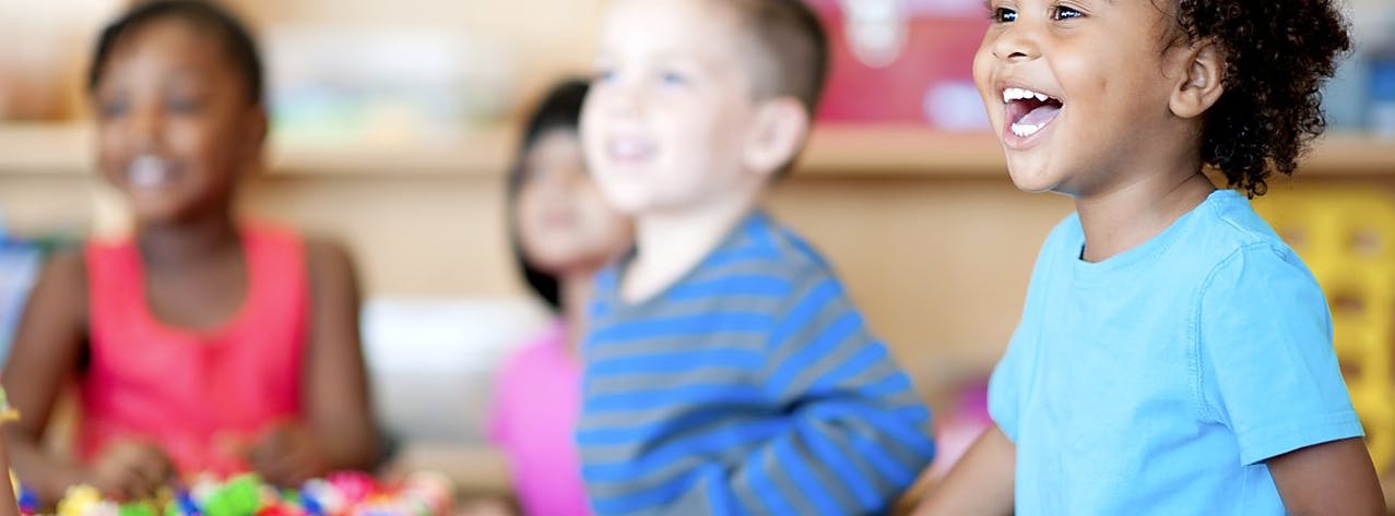 Three children in a classroom