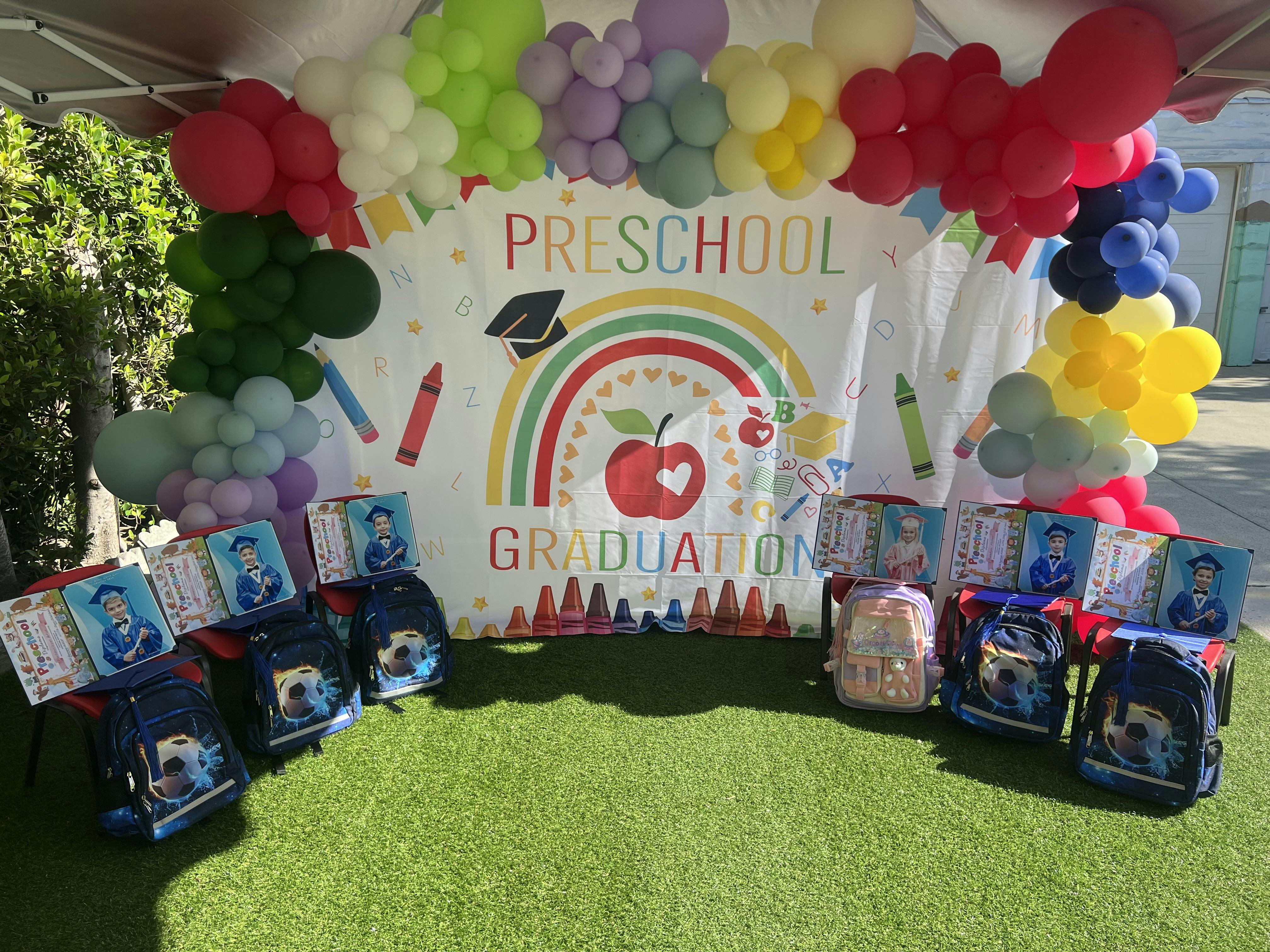 Preschool Graduation banner with balloons and backpacks