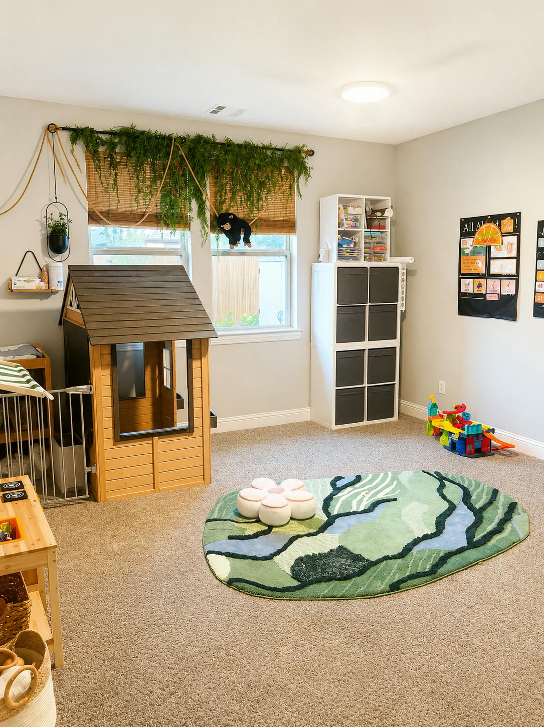 Playroom with a wooden playhouse, storage shelves, and a patterned rug