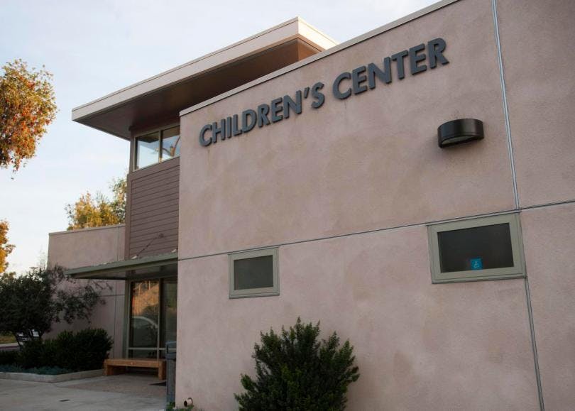 Exterior of a building with "CHILDREN'S CENTER" on the facade