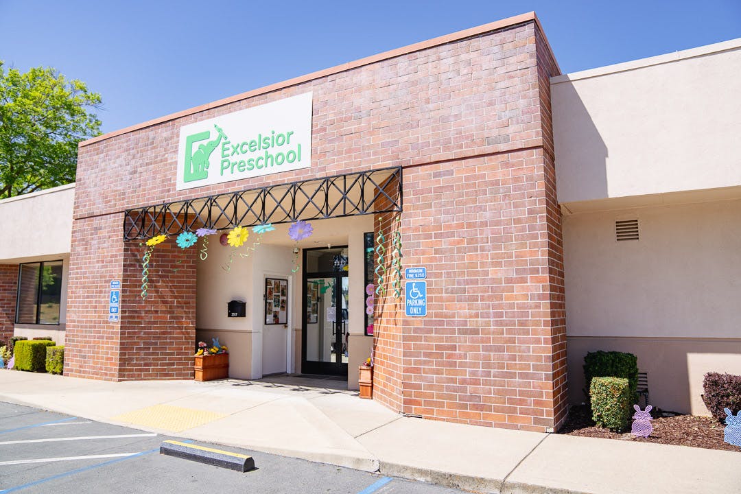 Excelsior Preschool building entrance with brick facade and sign