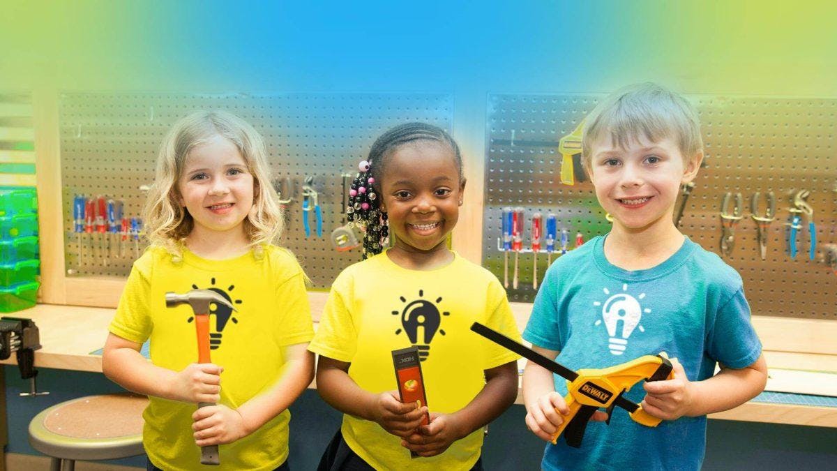 Three children holding tools
