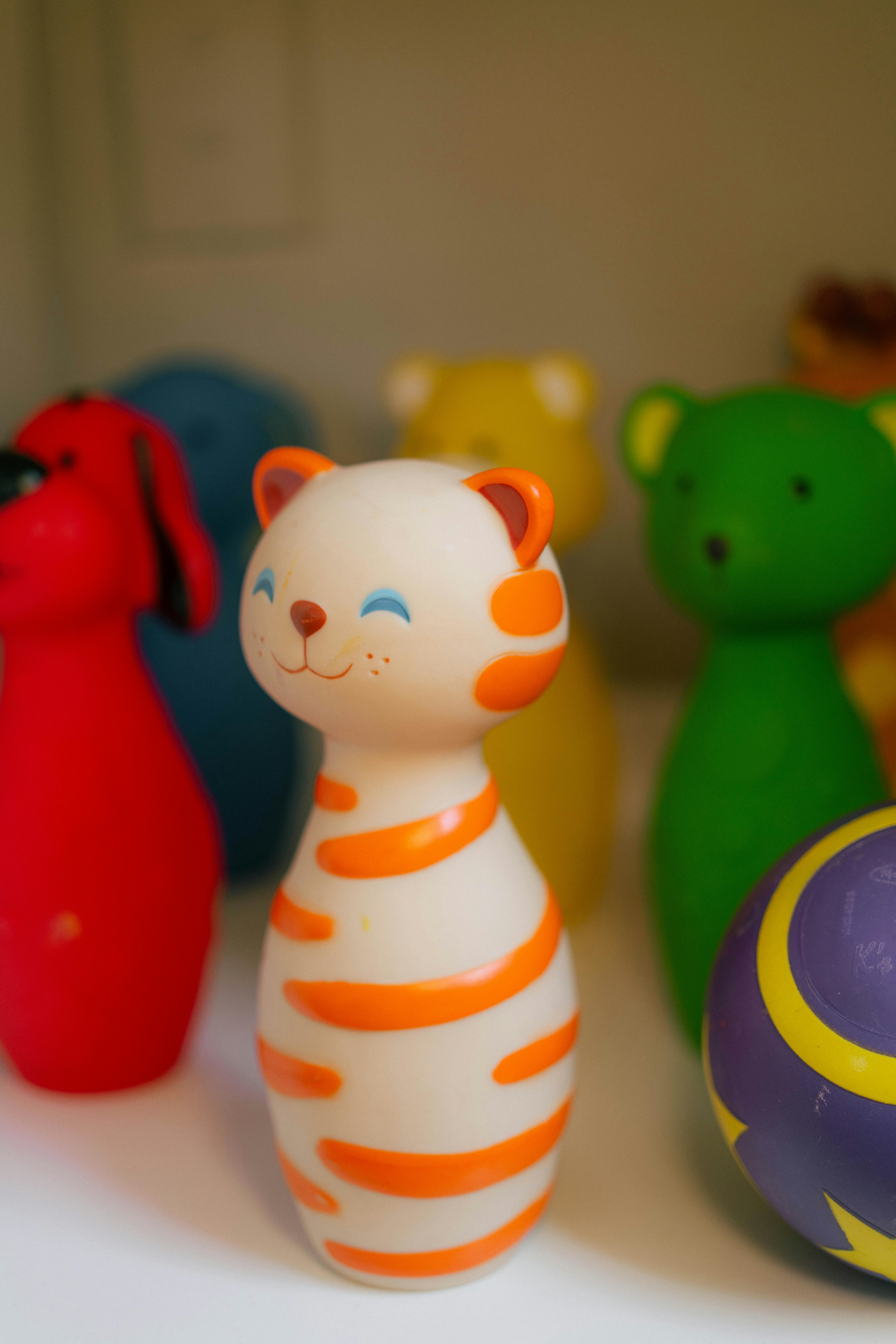 Set of colorful animal bowling pins and a purple ball