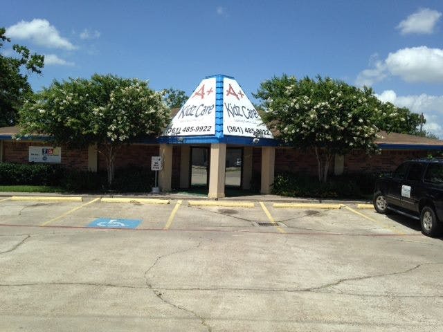 Building with a sign that reads "A+ Kidz Care"