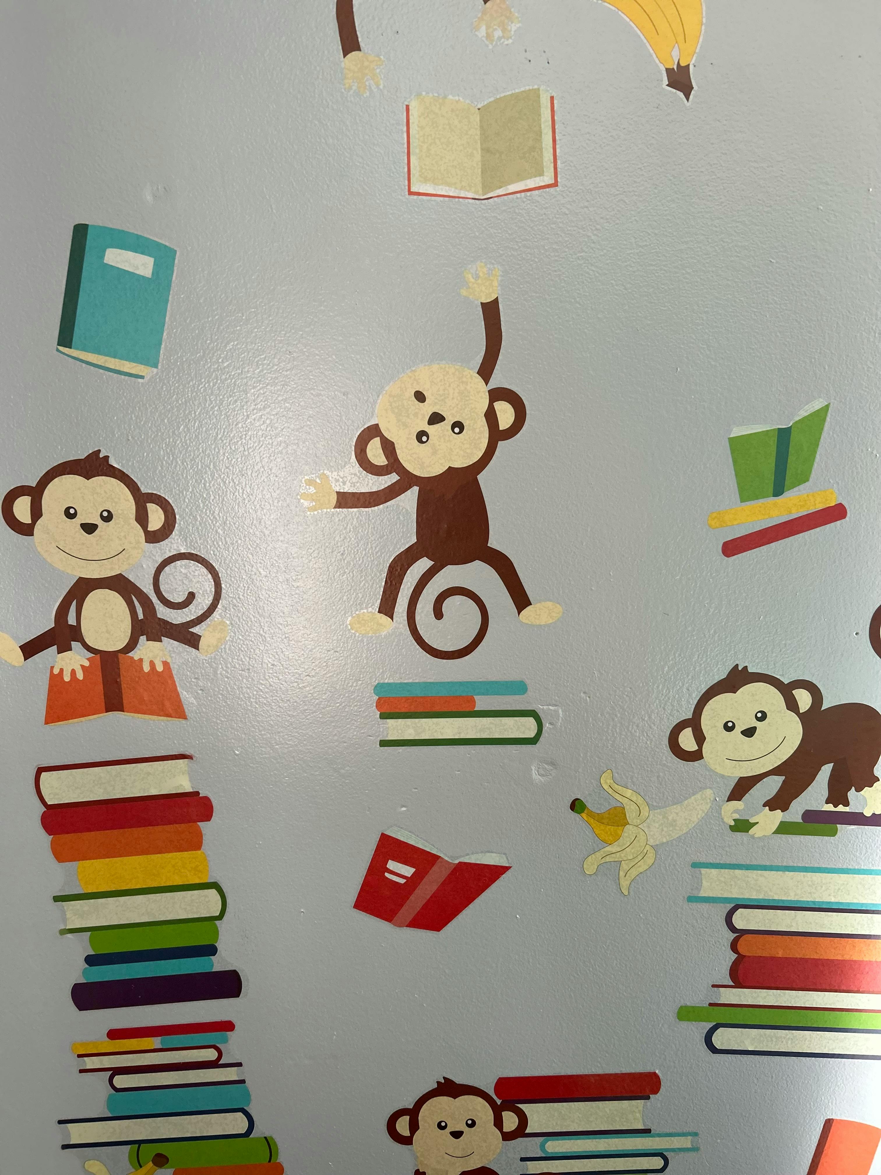 Cartoon monkeys and books on a light background