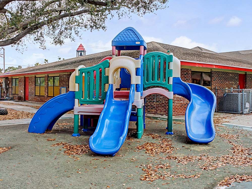 Playground equipment with multiple slides and climbing structures