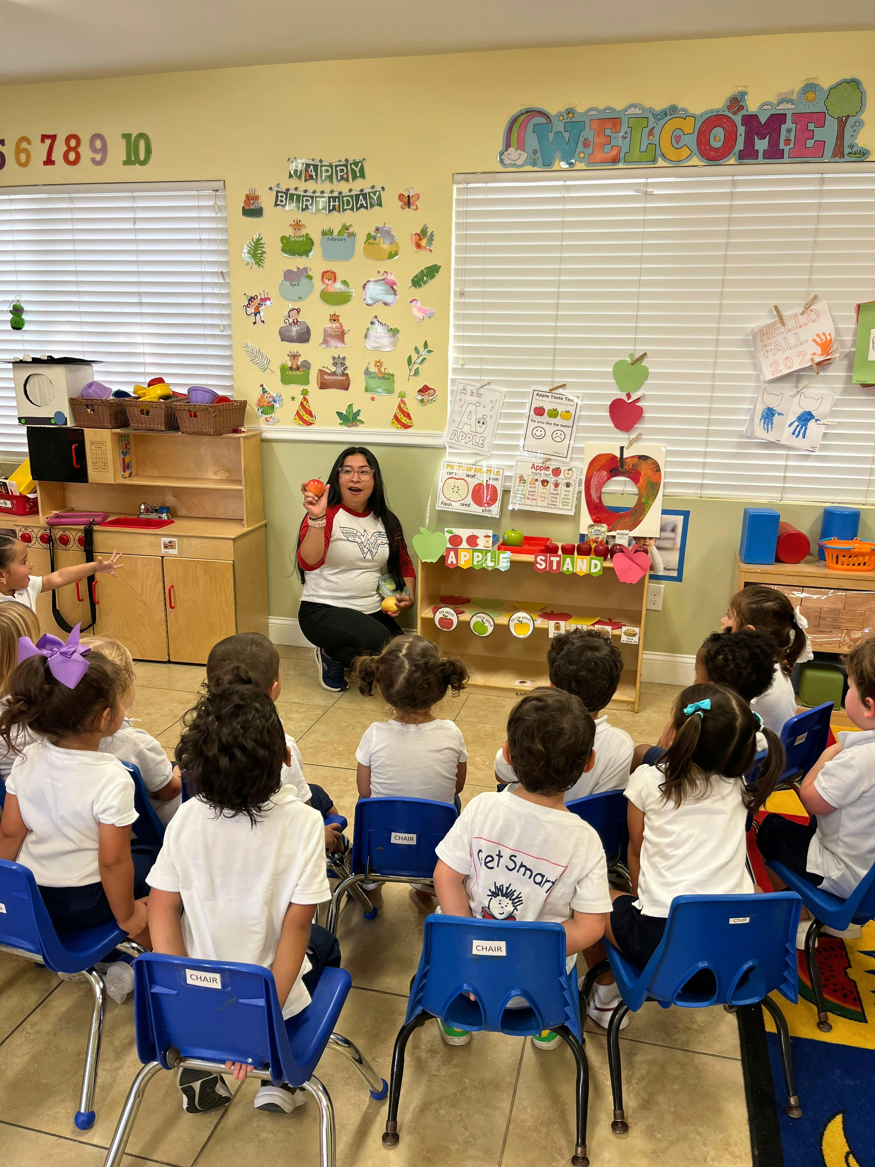 Person teaching a group of children in a classroom