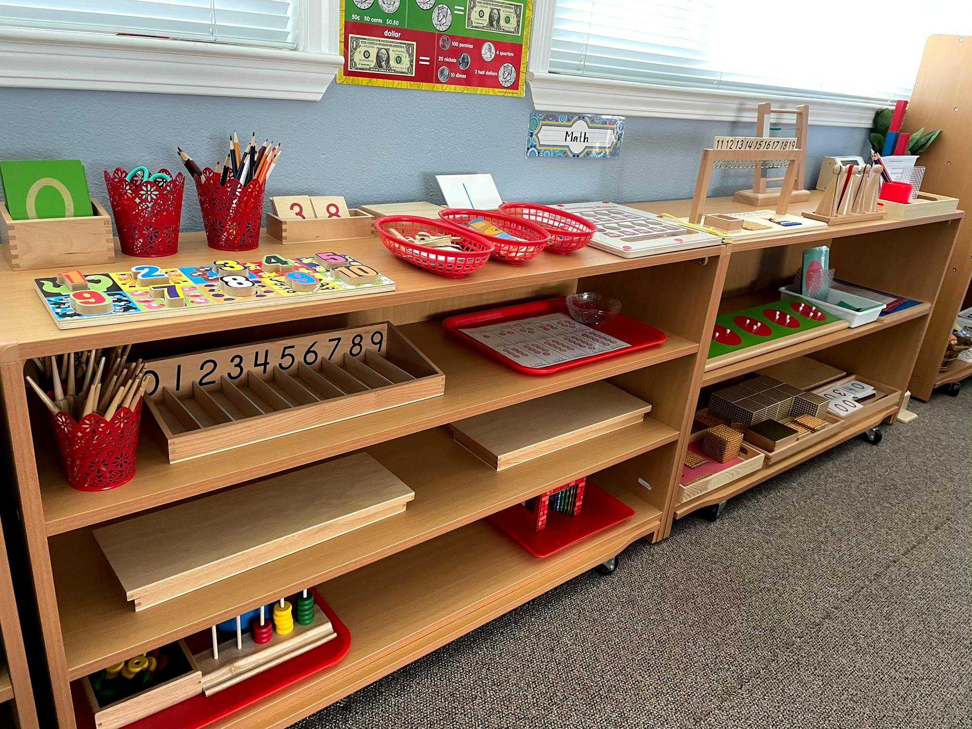 Shelves with various educational materials and supplies in a classroom