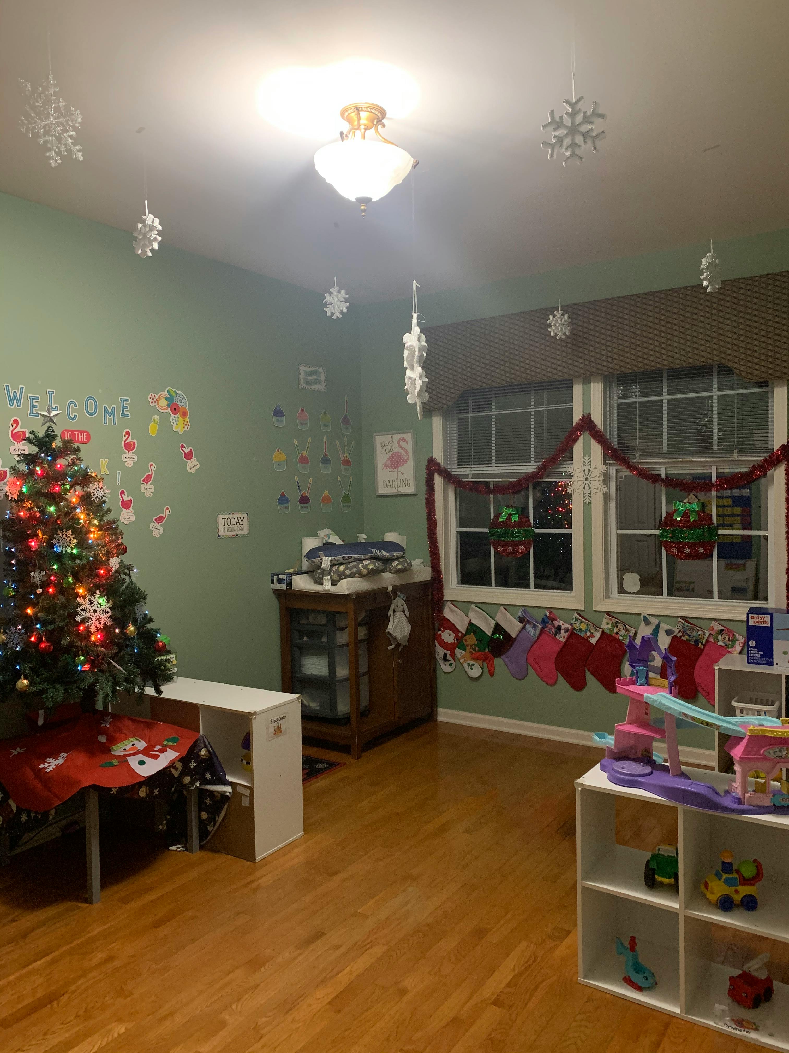 Christmas tree and stockings in a room with holiday decorations