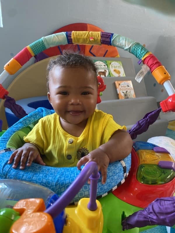 Child in a colorful activity center