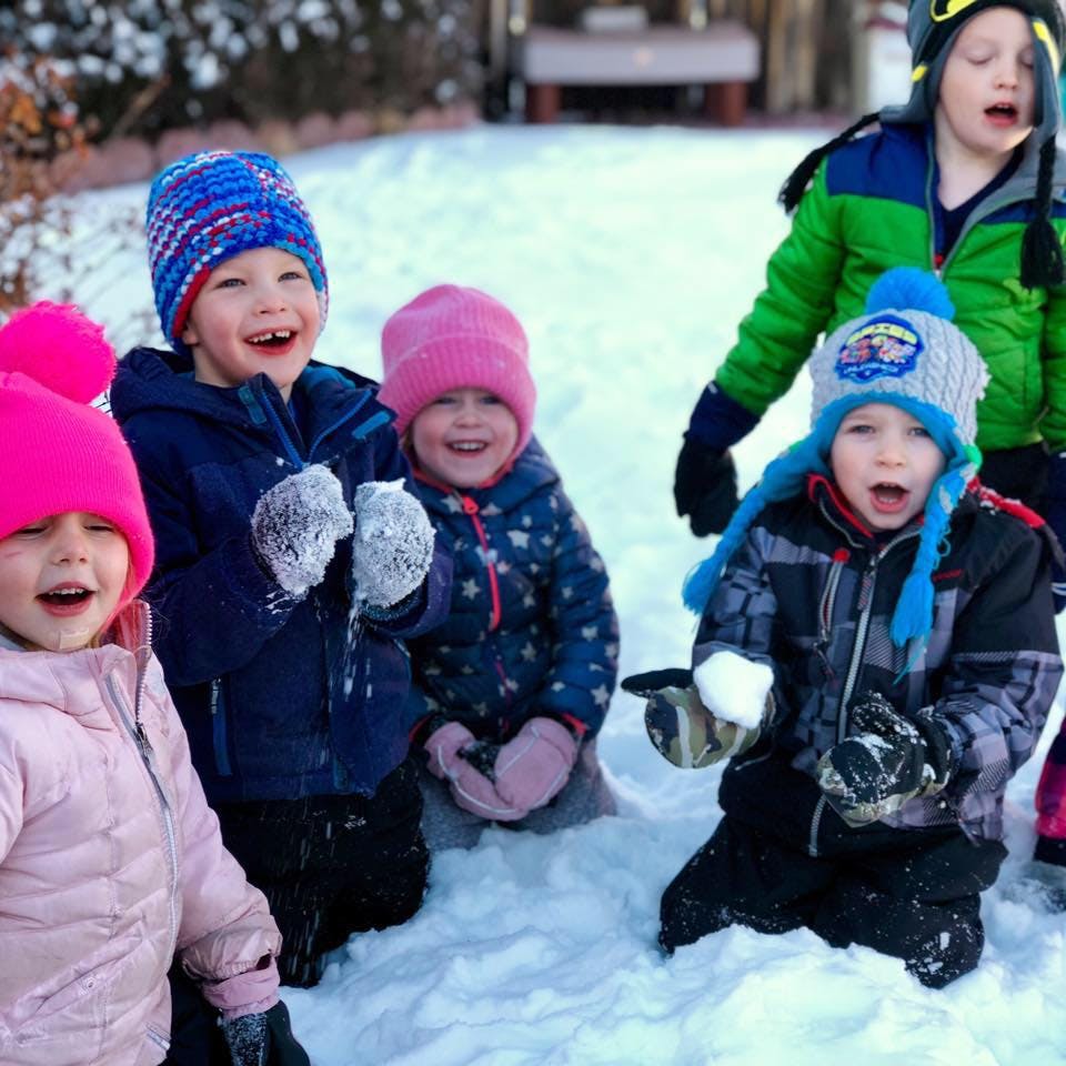 Group of children playing in the snow