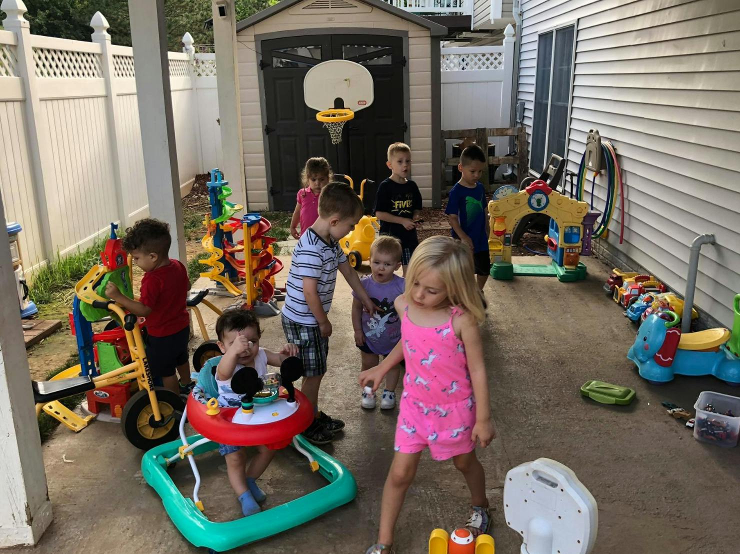 Group of children playing with toys outdoors