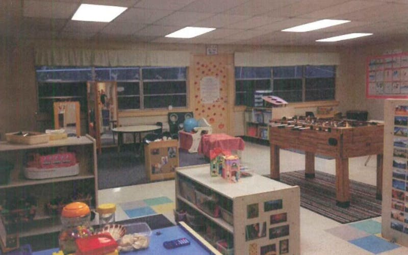 Classroom with shelves of toys, foosball table, and colorful decor