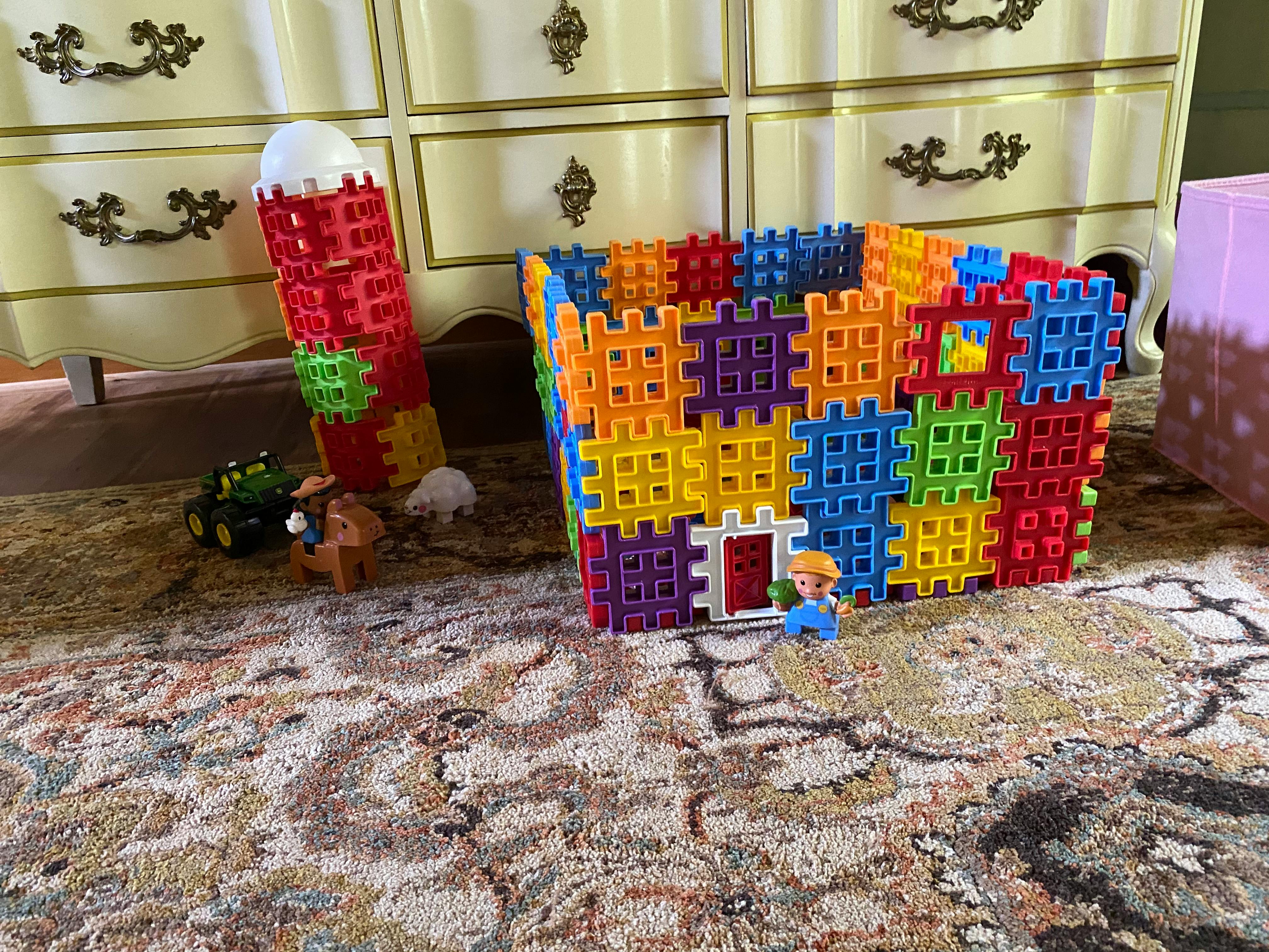 Toy barn and silo made from colorful interlocking blocks