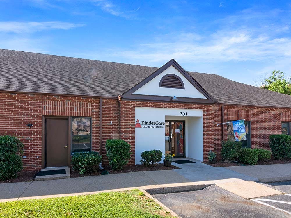 KinderCare Learning Centers building with a sign above the door