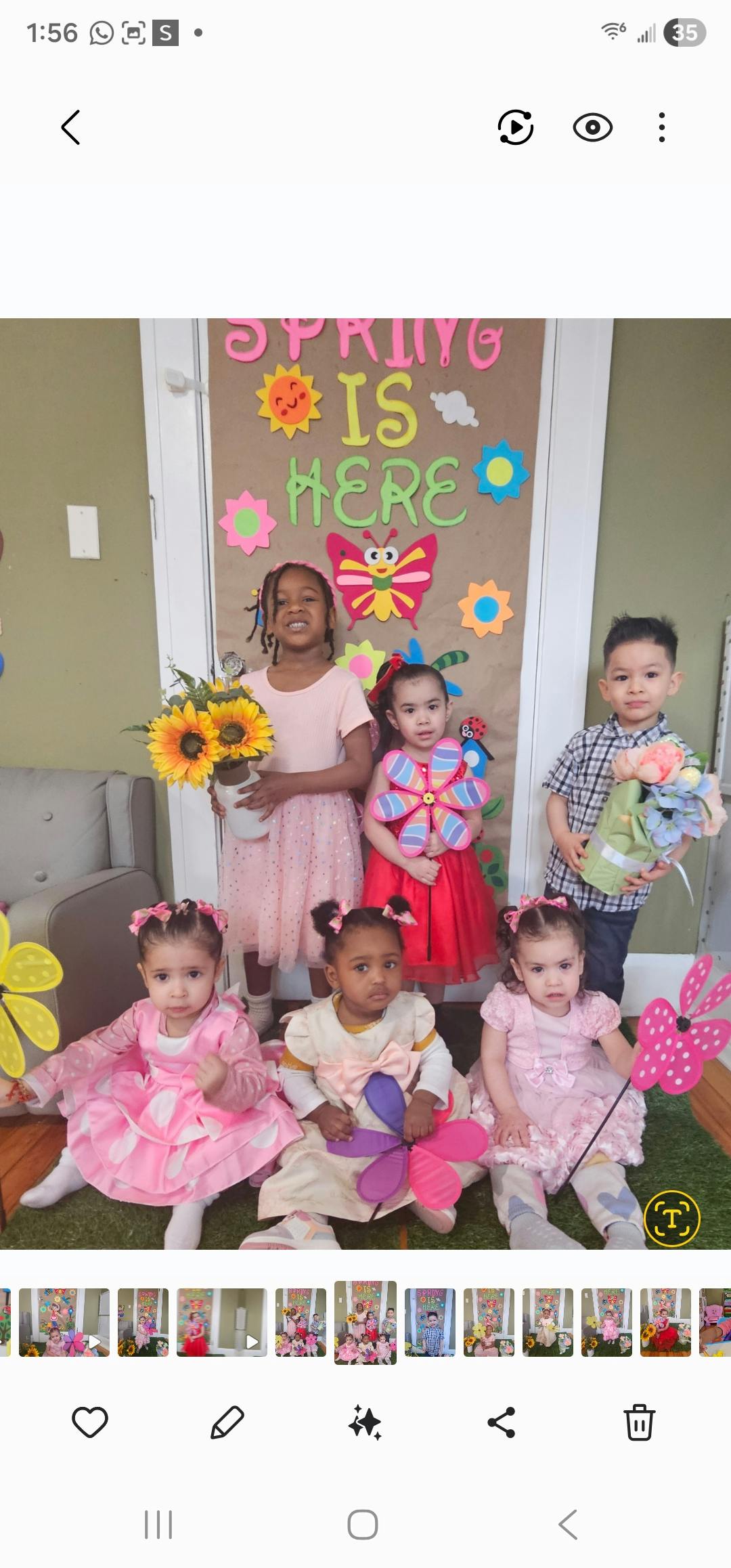 Group of children and toddlers posing with spring decorations