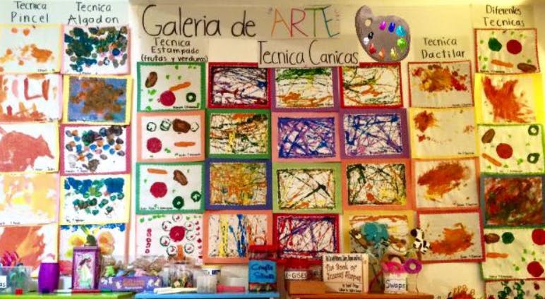 Children's artwork displayed on a wall