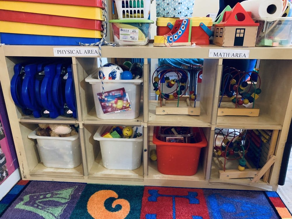 Shelves with toys and learning materials in a classroom