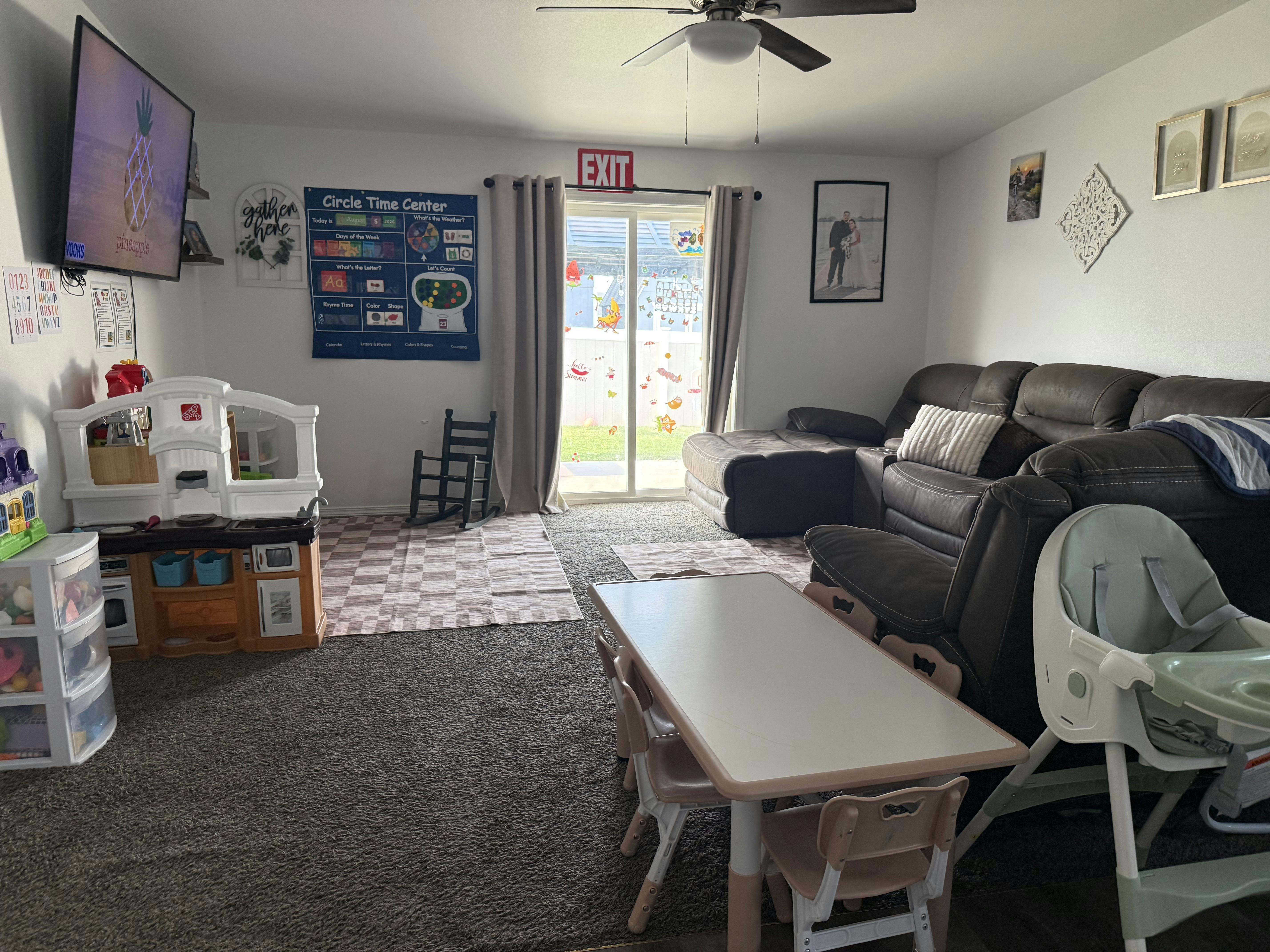 Living room arranged as a children's play area with toys and a small table