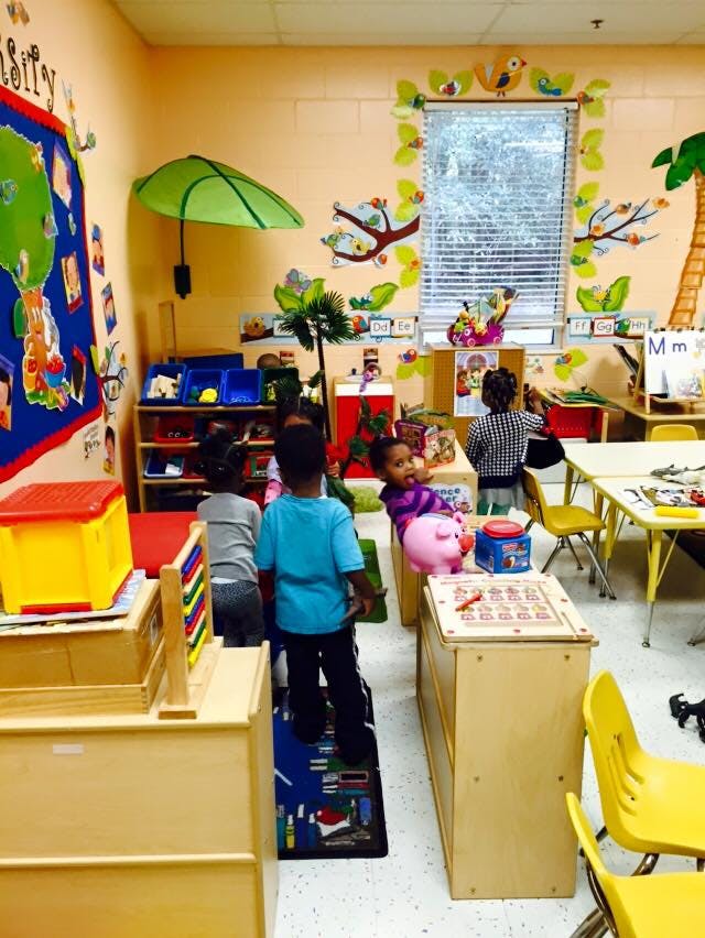 Children playing in a classroom