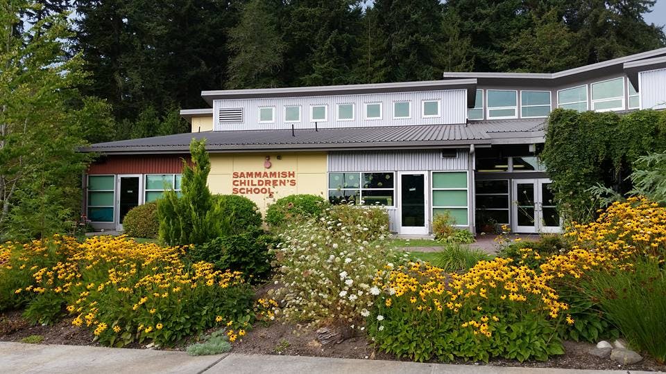 Building with "Sammamish Children's School" text on the facade, surrounded by flowers
