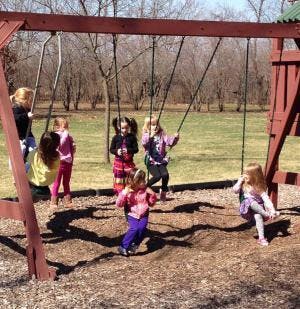 Children on swings at a playground