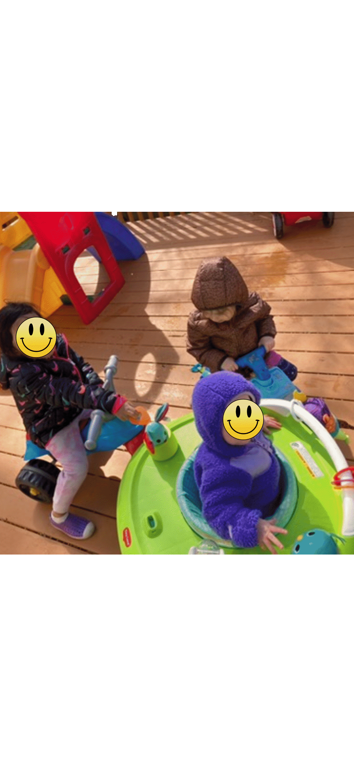 Three children playing with outdoor activity toys on a deck