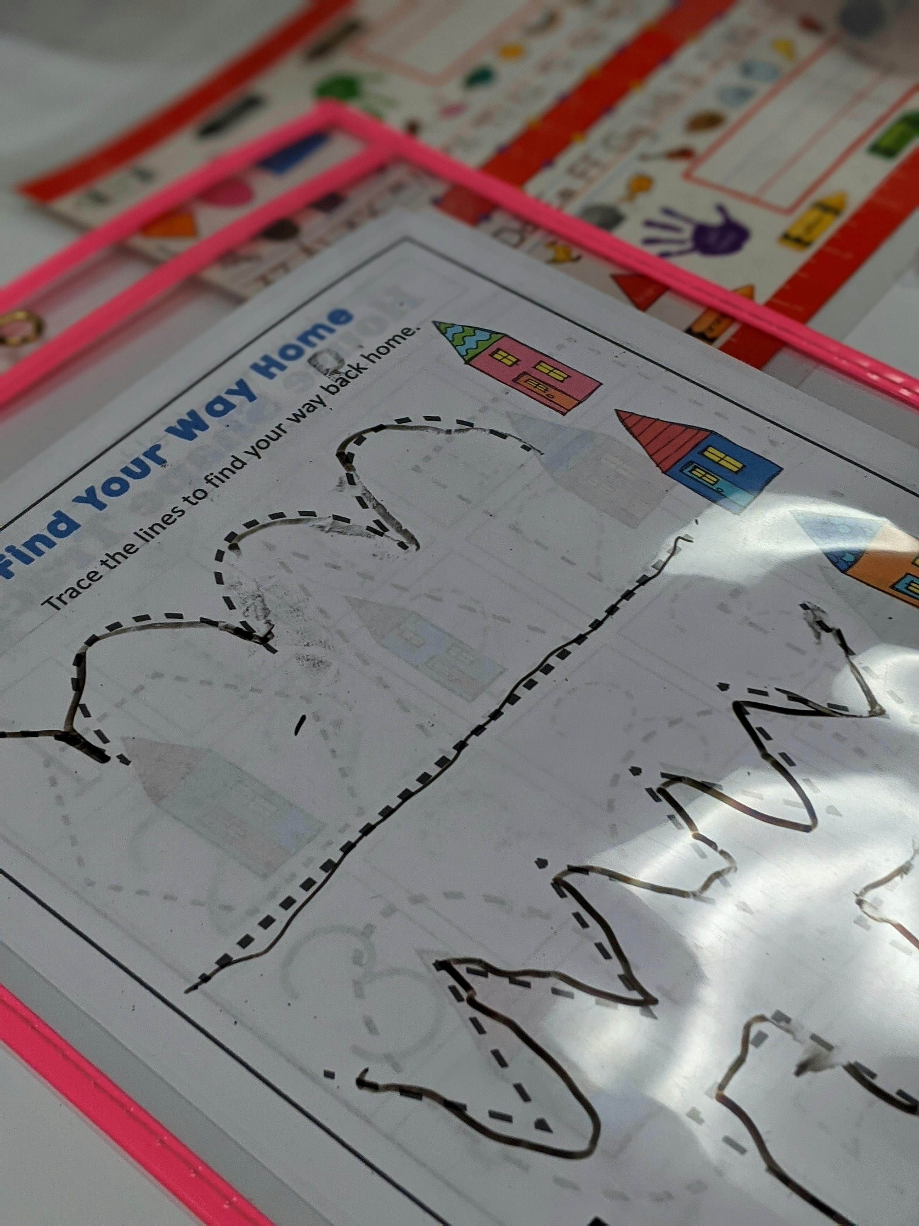 Tracing worksheet with "Find Your Way Home" text and house illustrations