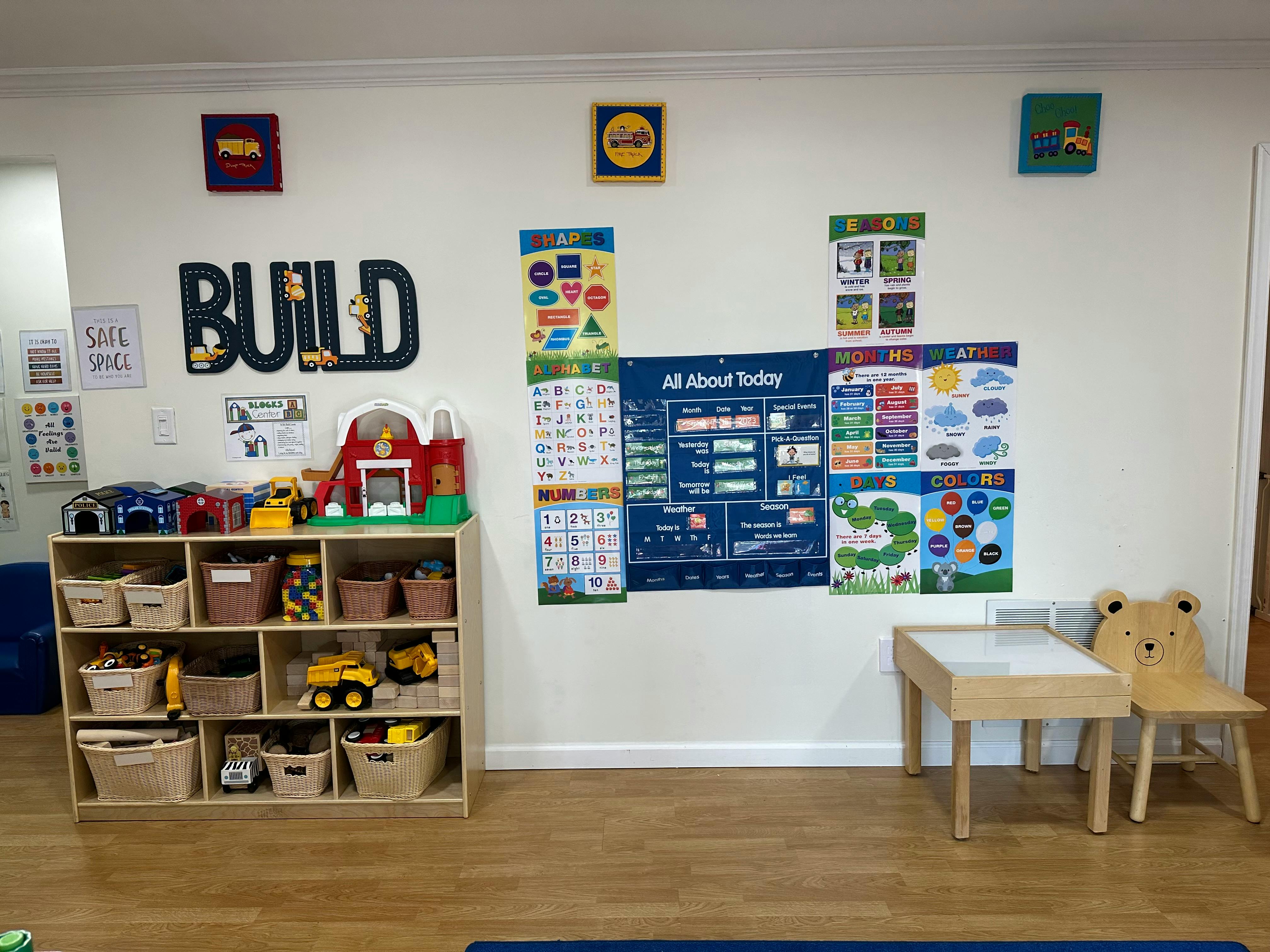Classroom with a toy shelf, small table, and chairs