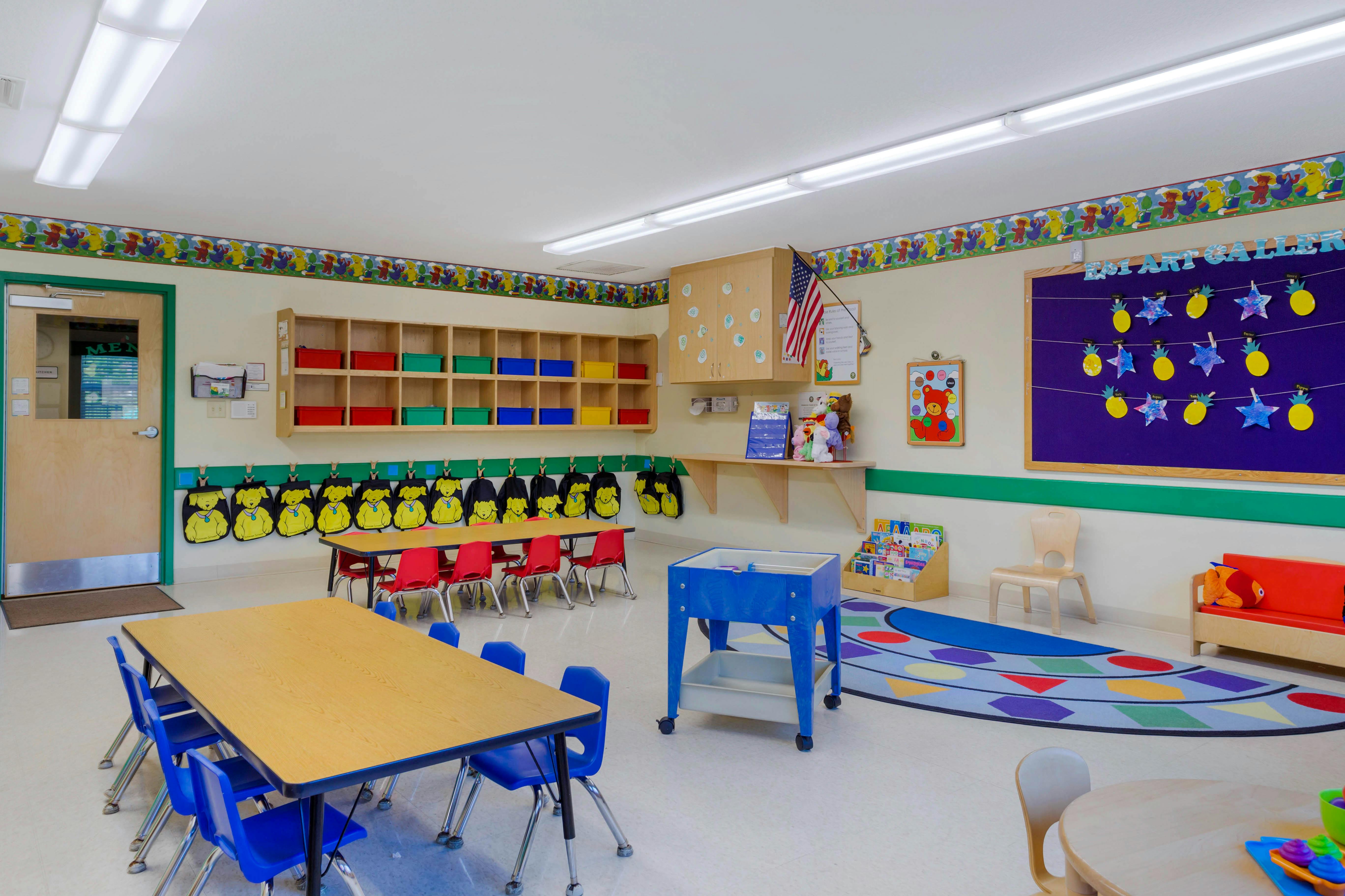 Colorful classroom with child-sized tables and chairs