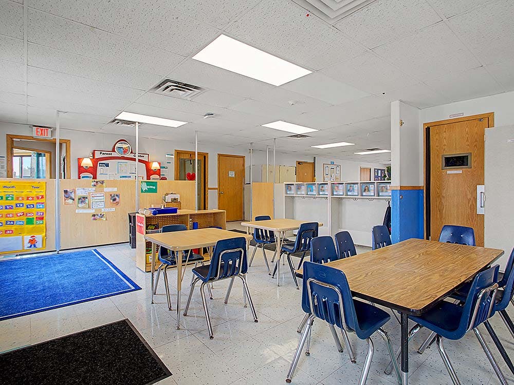 Classroom with child-sized tables and chairs