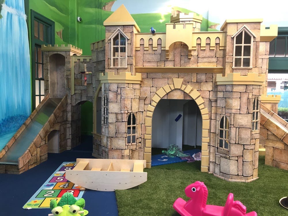 Play castle with slides and archways