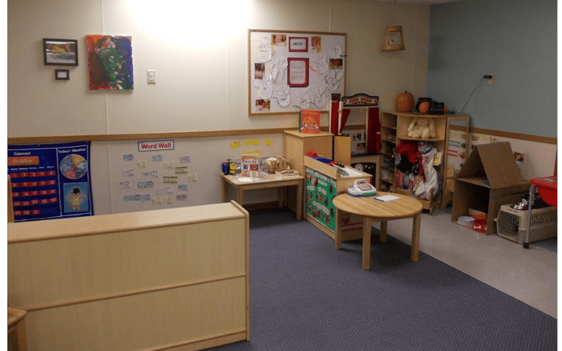Classroom with children's furniture, toys, and decorations