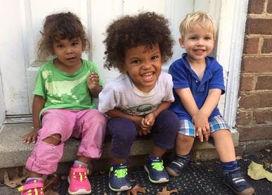 Three children sitting together