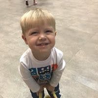 Child smiling and looking up