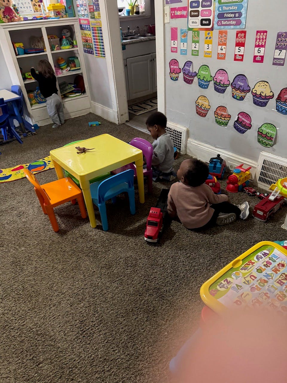 Children playing with toys in a classroom