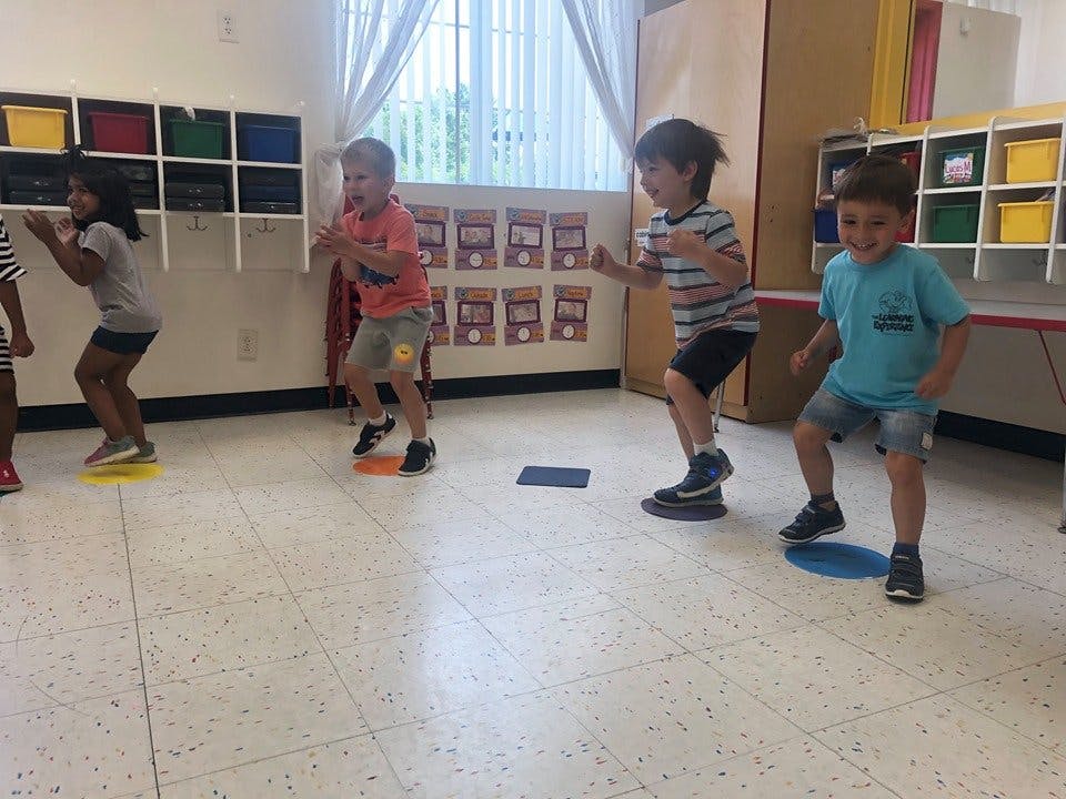 Children playing a game in a classroom