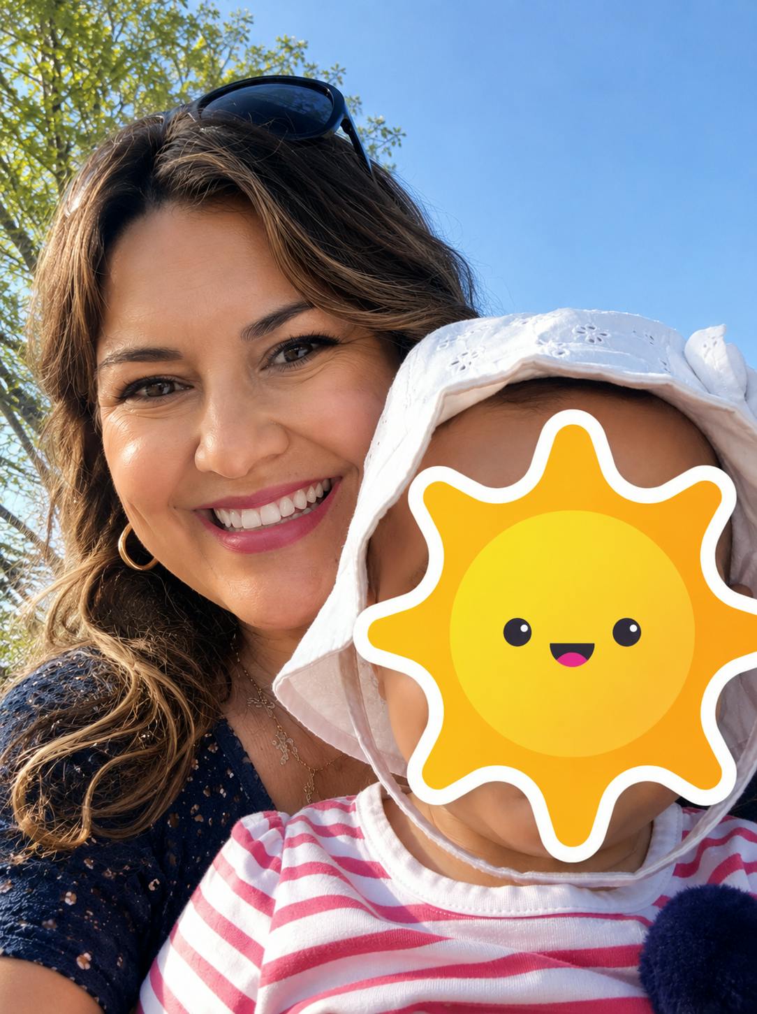 Adult and child wearing a sun hat outdoors