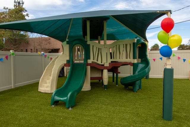 Playground with slides and a shade canopy