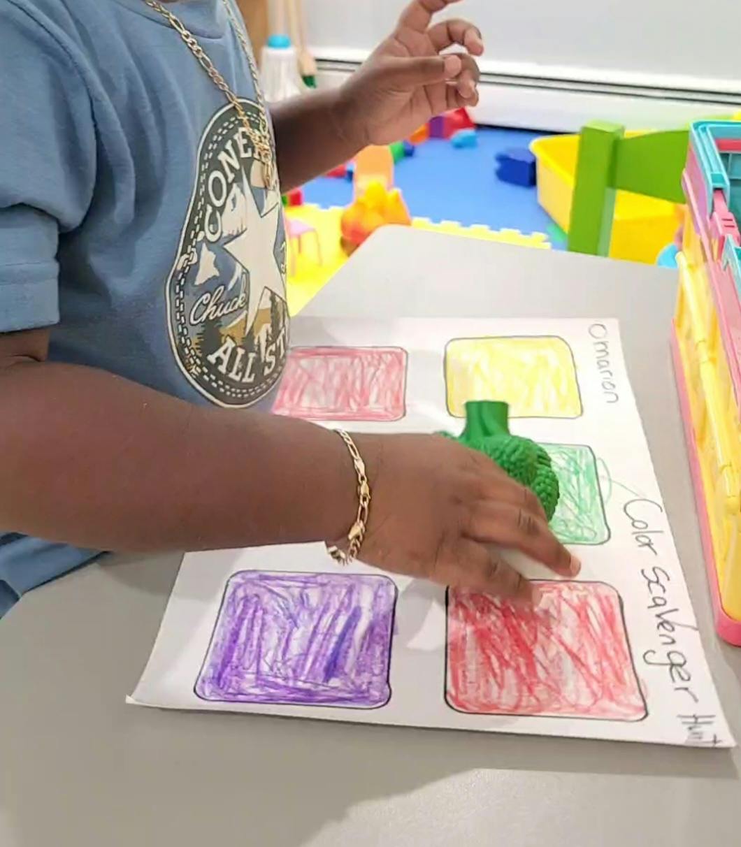 Child playing a color scavenger hunt game
