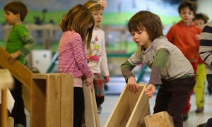 Children playing with wooden blocks