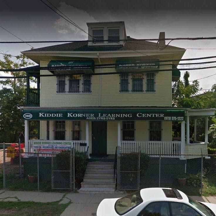 Kiddie Korner Learning Center building with green awnings